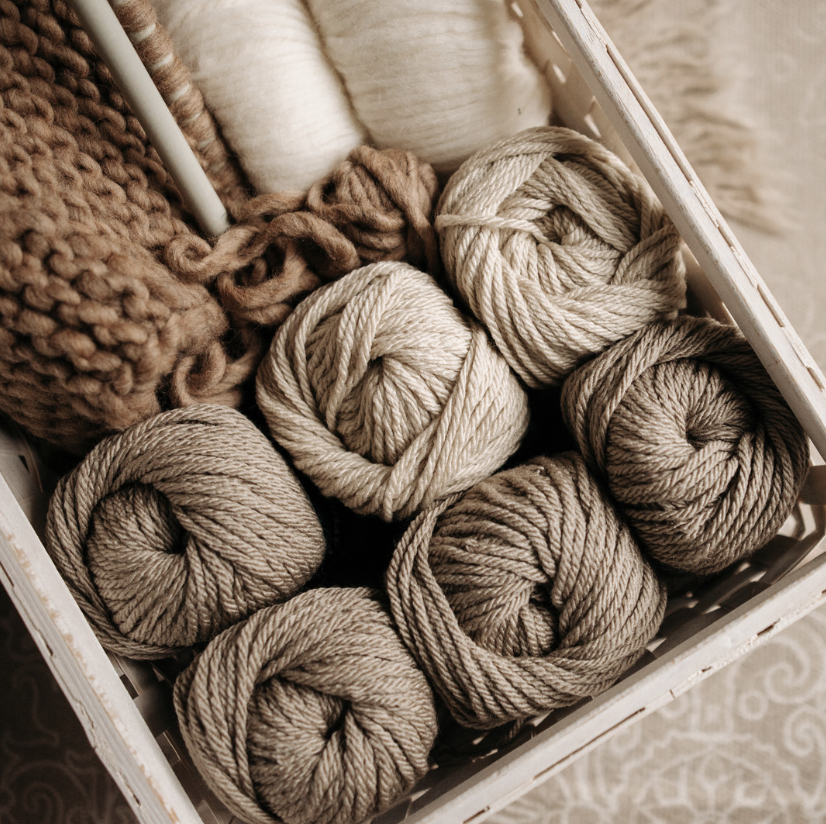 box of yarn in neutral earth shades